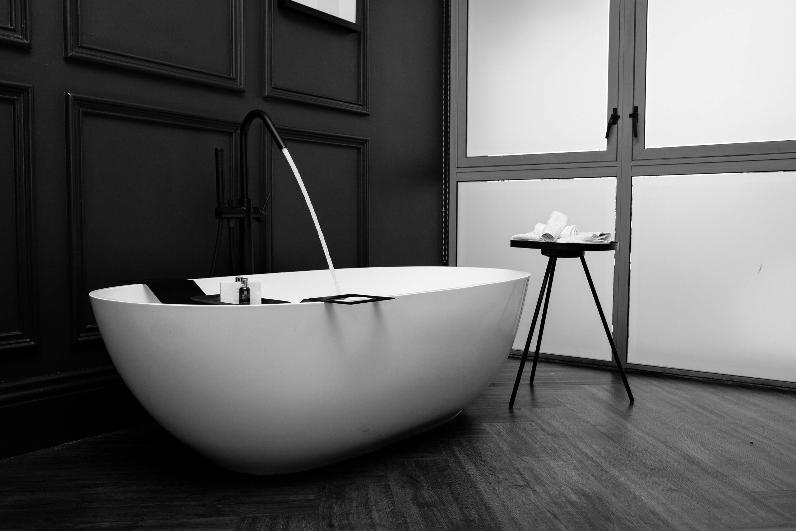Modern bathroom renovation with freestanding tub and sustainable materials