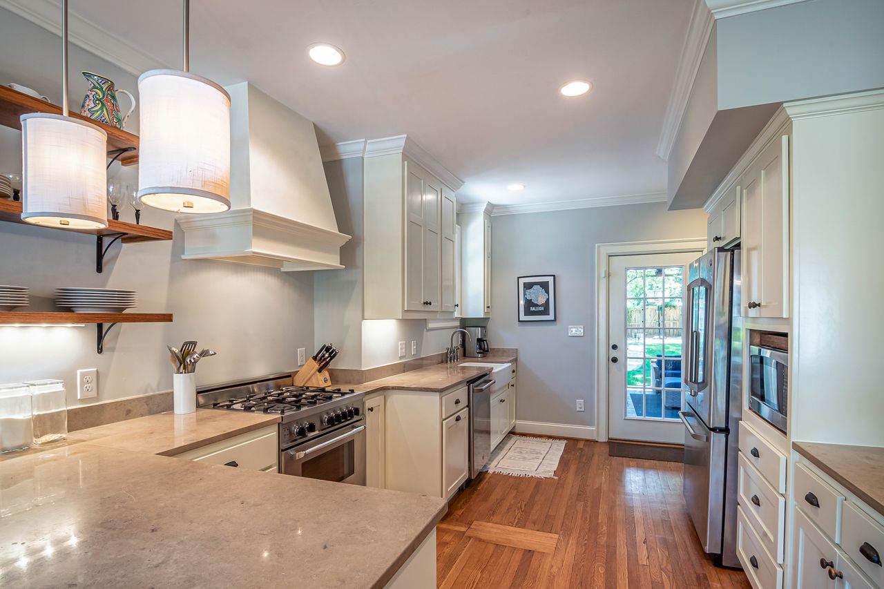 Modern kitchen design with custom cabinetry, quartz countertops, and efficient layout for South Florida homeowners.
