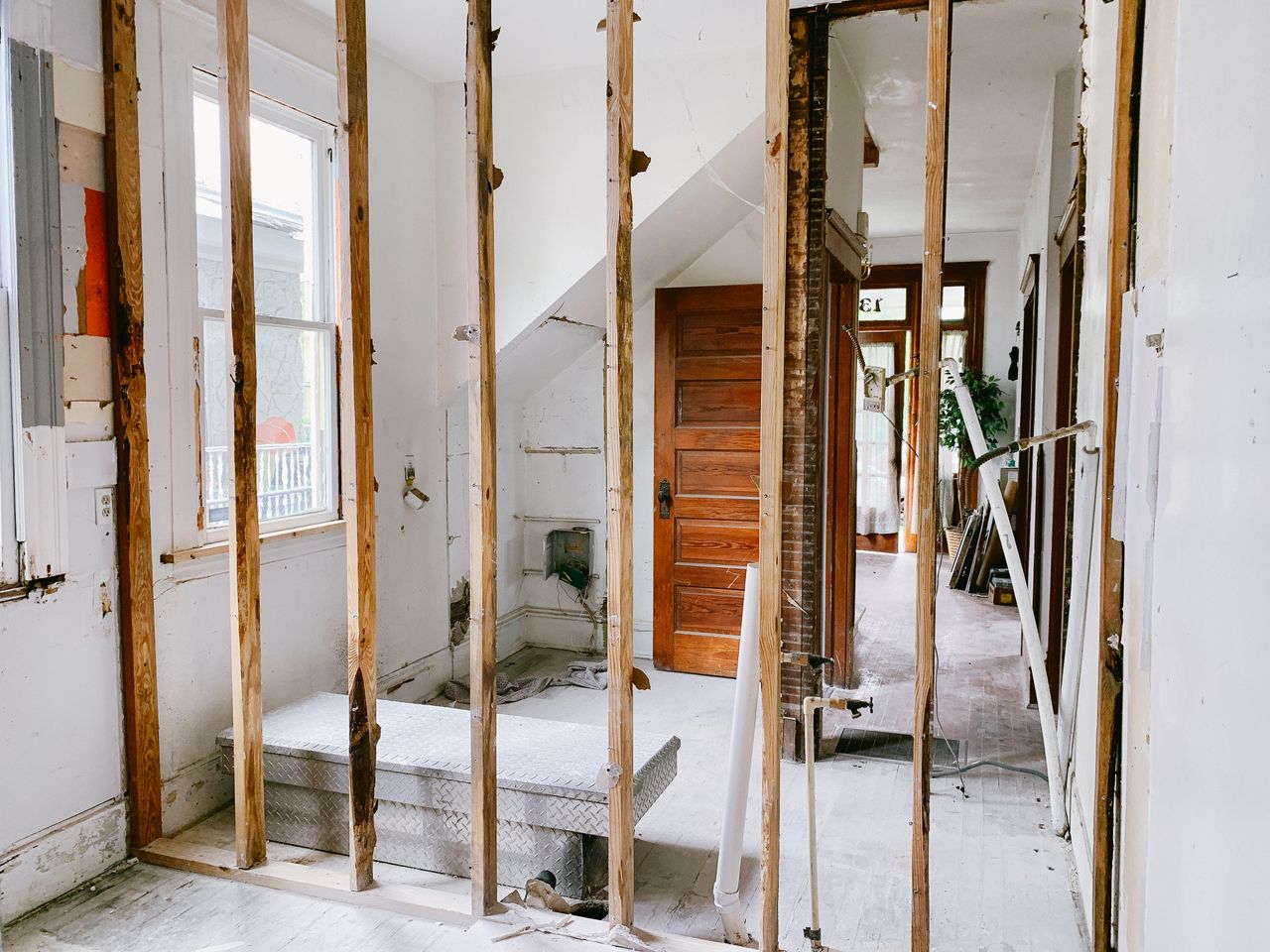 Interior demolition during home renovation project, exposed framing and construction phase in South Florida.
